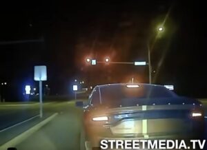 SRT Dodge Charger Hellcat at a red light after Leaving Police in the Dust in a High-Speed Chase with ease.