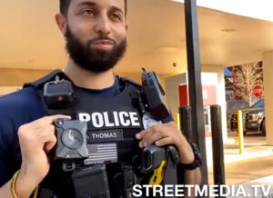 West Palm Beach Officer holds back his laughter while a live-streamer known as, Jon Eugene Minadeo II, went on a racist conspiracy rant.