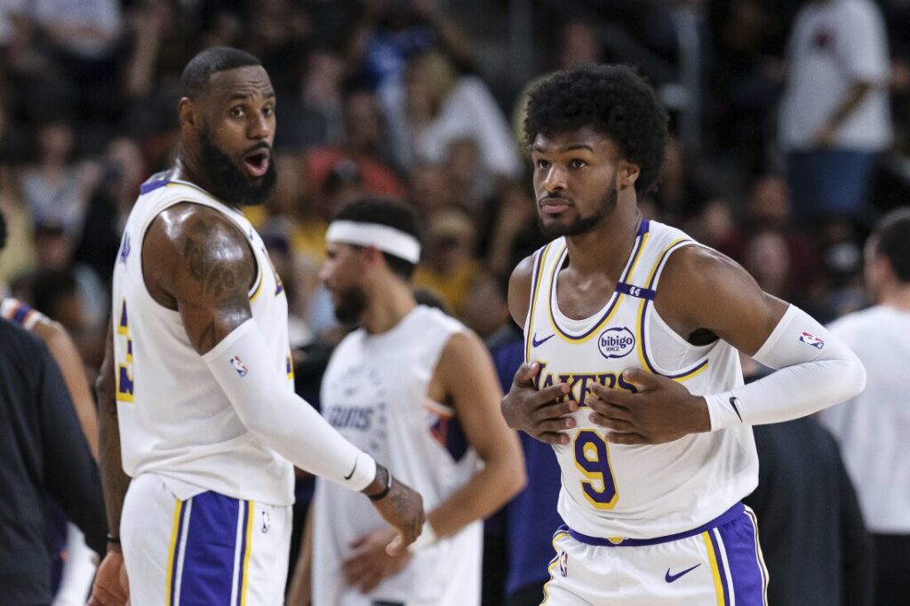 LeBron and Bronny James made NBA history as the first father-son duo to share the court in a Lakers preseason game against the Suns.